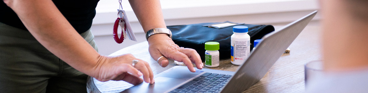 Nurse helping teen with medication management