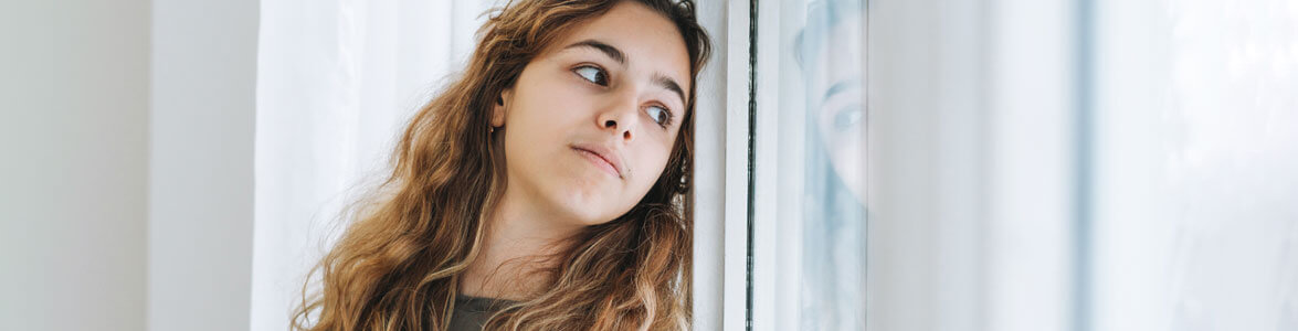 Sad Girl Looking Out Window