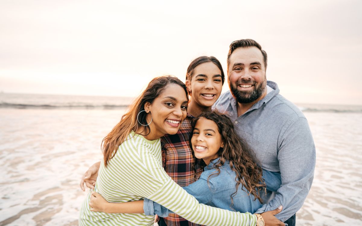 A smiling family at the beach
